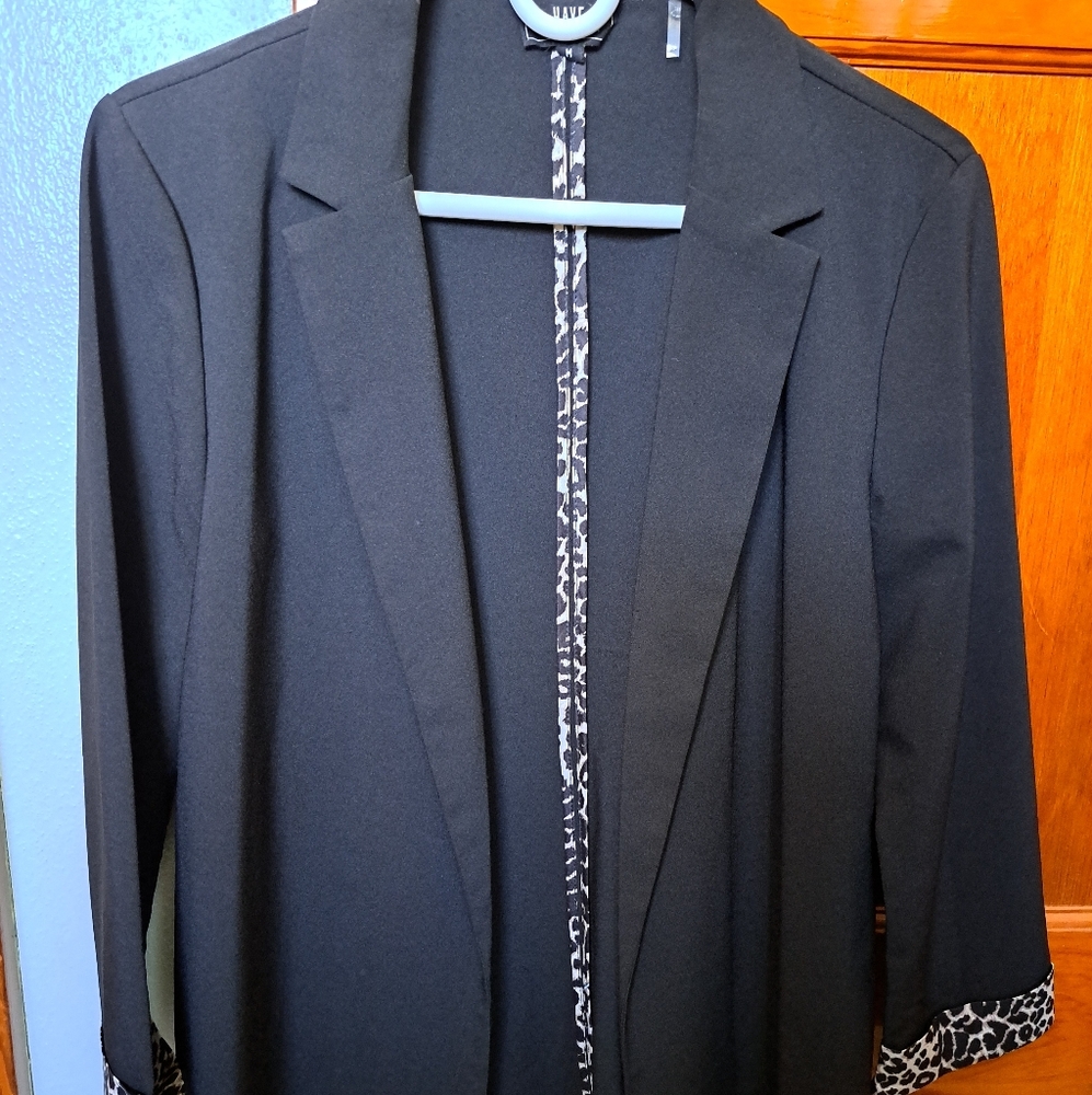 Have Black Blazer with Notched Lapel and Smooth Finish